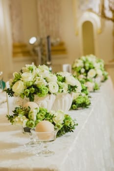 Wedding table decoration, wedding setting, wedding flowers on table, shallow depth of field