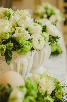 Wedding table decoration, wedding setting, wedding flowers on table, shallow depth of field