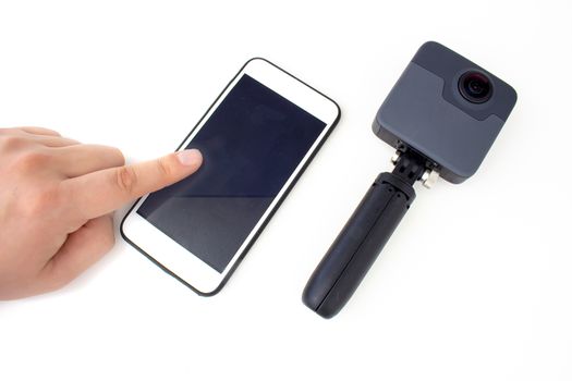 A person touching a smart phone with a Generic 360 camera