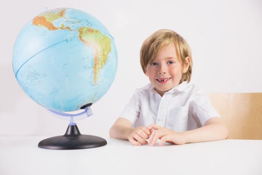 Student learning geography with globe