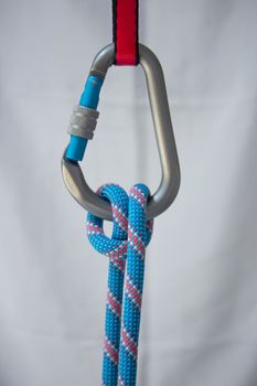 Munter hitch tied with a climbing rope to a pear shaped locking carabiner