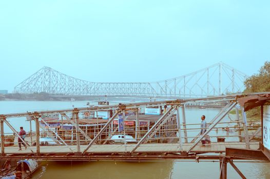 Fairlie Place Ghat Ferry Terminal bridge, a Ferry service transportation a quick way to travel for commuters from bank of the River Hooghly river that connects the Kolkata and Howrah city. India South Asia Pacific March 2020