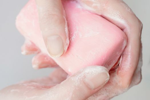 Antibacterial soap in the hands. Hand disinfection with soap. 