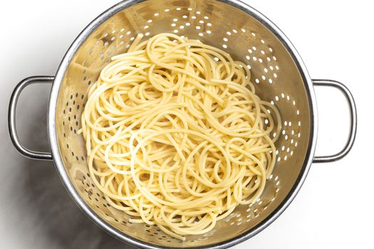 spaghetti pasta in a colander