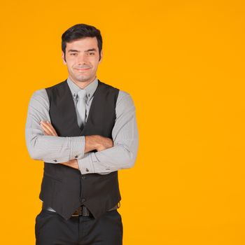 A young businessman fold his arms over the chest with confidence