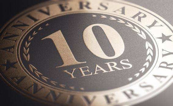 10th anniversary, golden stamp over black background. Ten years 