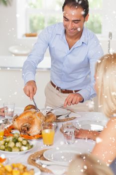 Man standing to carve the turkey