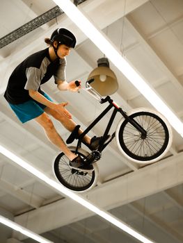 BMX Rider Doing Extreme Tricks on Bike in the Skatepark. Healthy and Active Lifestyle.