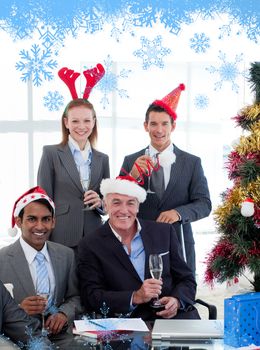Smiling business people wearing novelty christmas hat