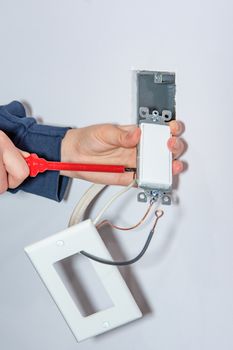 Installing a wall switch in a drywall