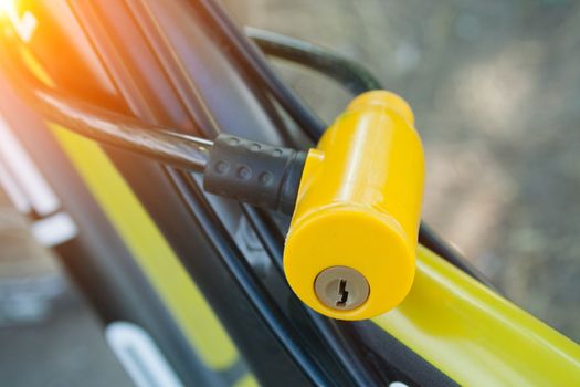Yellow plastic lock on a bicycle