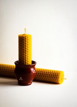 still life with two beeswax candles