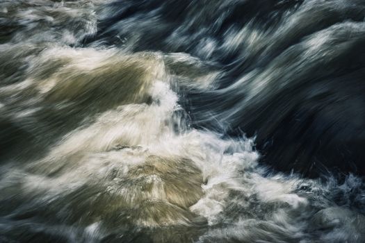 dark ripples on a wild river