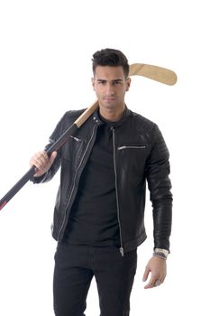 Handsome young man with a hockey stick