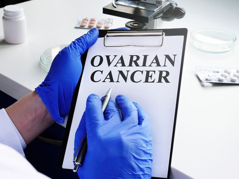 Ovarian cancer diagnosis in the doctor hands.