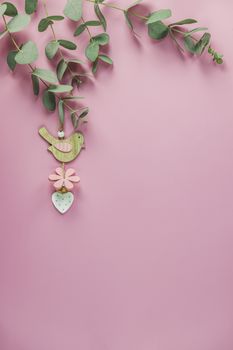 Eucalyptus leaves on pink background. Frame made of eucalyptus b
