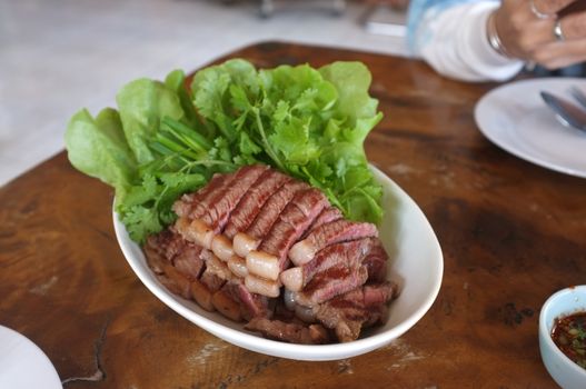A world renowned delicacy from Sakon Nakhon , Thailand . Pon Yang Kham grilled beef Steak at BaijakCoffeeAndSteakHouse
