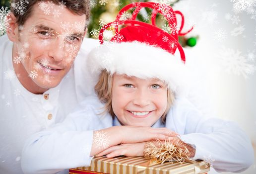 Composite image of bright father celebrating christmas with his son