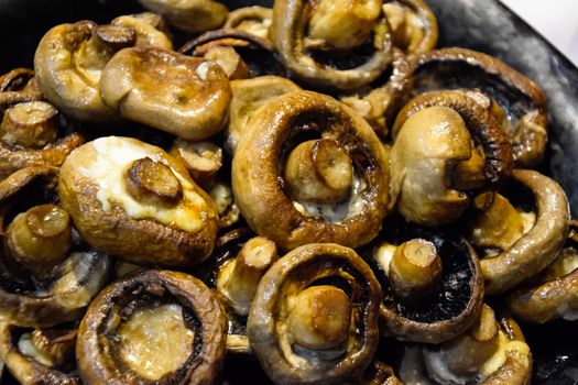 Baked mushrooms in plate. fried mushrooms with mayonnaise.