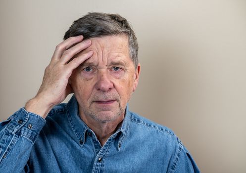 Senior caucasian elderly retiree looking depressed and anxious