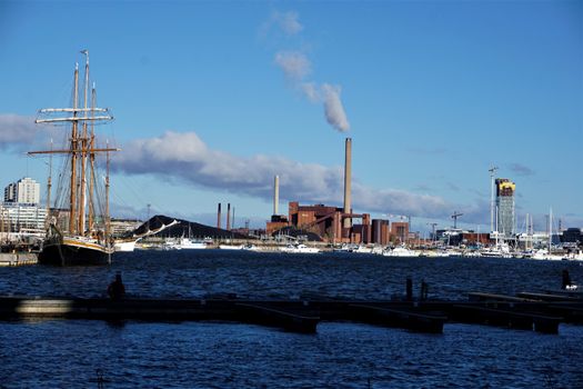 View to the coal power plant of Helsinki with sailboat