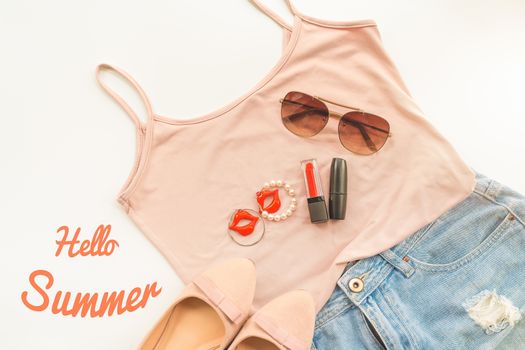 Hello summer concept. Female clothes, and accessories layout on 