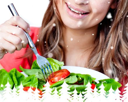 Close up of a delighted woman is eating a salad 