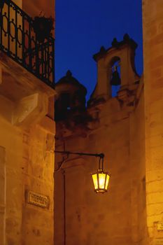Old fashioned lantern on St.Publius square at night. Mdina, ancient capital of Malta.