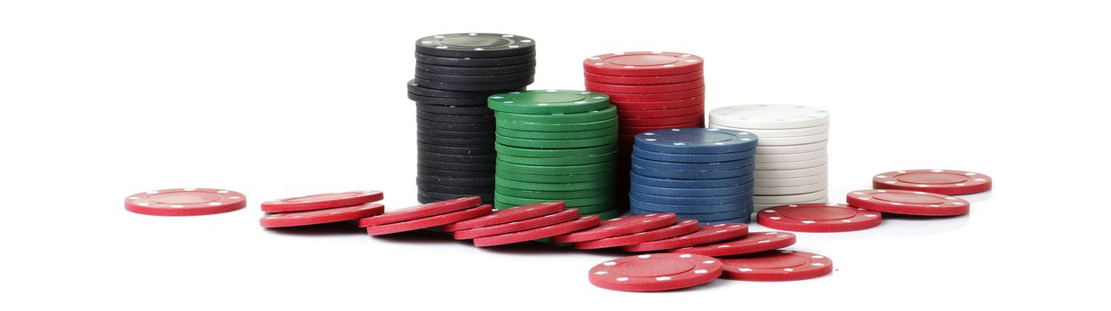 Piles of casino betting chips on a white background