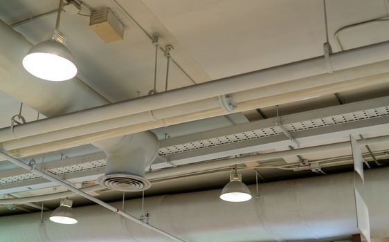 Air duct, wiring and plumbing in the mall. Air conditioner pipe,