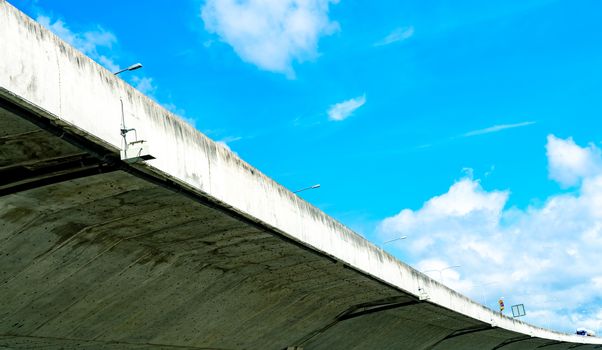 Bottom view of elevated concrete highway. Overpass concrete road