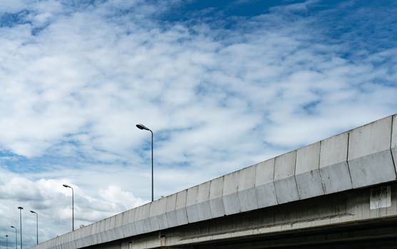 Elevated concrete highway and street lamp pole. Overpass concret