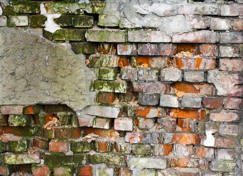 cracked brick wall with broken plaster