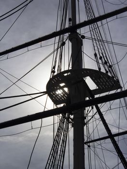 Sailing ship rigging backlit by sun