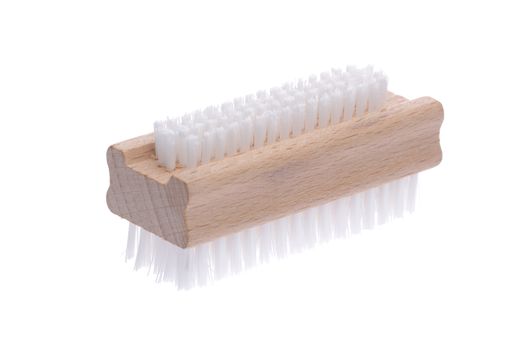 traditional wood nail brush with short bristles inclined on a white background