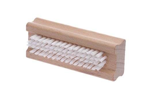 traditional wood nail brush with short bristles inclined on a wh