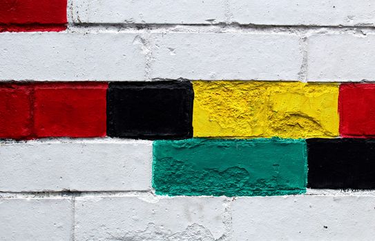 Colorful varnished bricks on a wall of a building