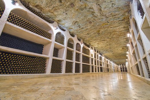 Wine bottles in winery cellars, old wine bottles storage in the underground