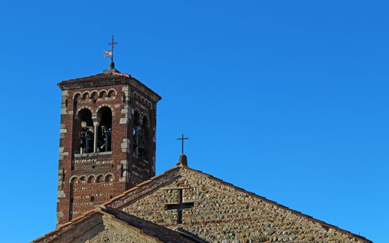 Belfry and roof top of an italian romanesque church complex