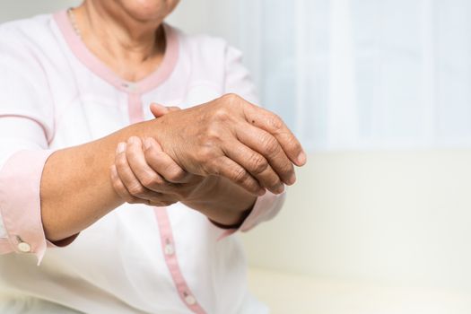 wrist hand pain of old woman, healthcare problem of senior conce