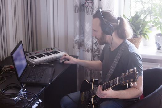 Musician composing music at home