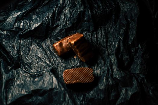 Chocolate candies on a black background