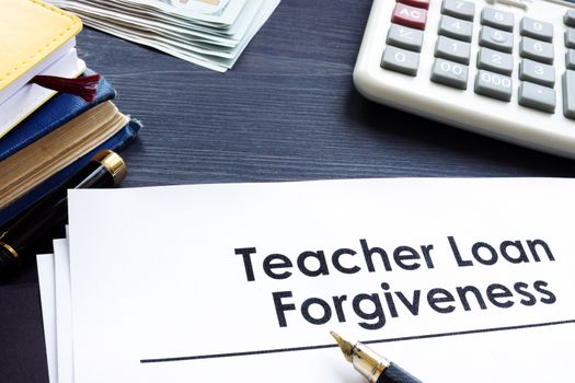 Teacher Loan Forgiveness documents on a table.