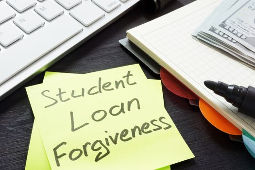 Student loan forgiveness written on a memo stick.