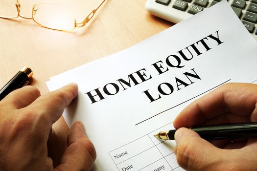 Document with name home equity loan on a desk.