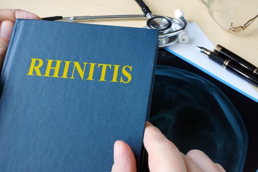 Book about Rhinitis on a hospital desk.