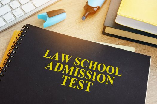 LSAT Law School Admission Test on a desk.