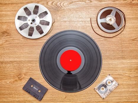 vinyl record with cassetes and reel tape