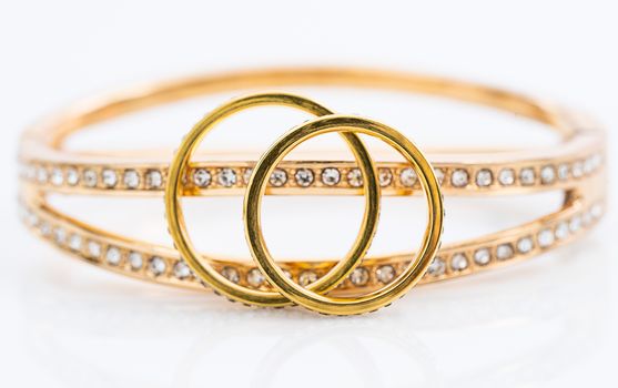 Closeup Gold ring diamond gem. Gold wedding rings with diamond on white background
