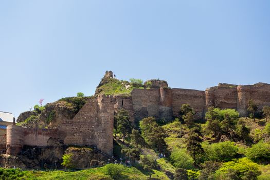Tourists in Narikala fortress. Famous landmark in Tbilisi, capital of Georgia country.